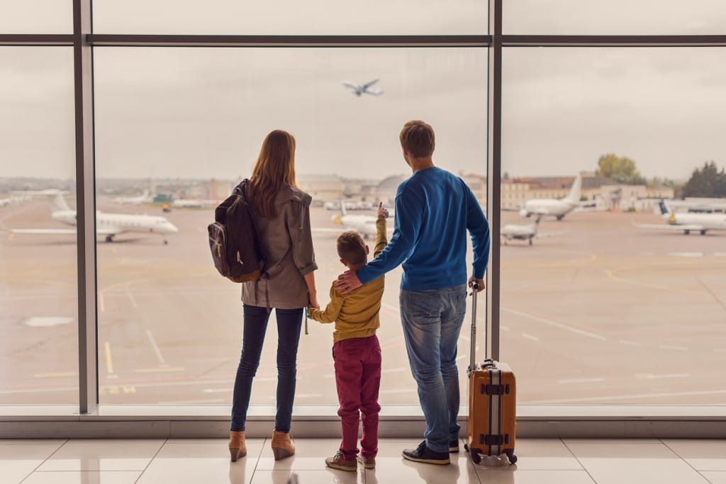 Packed Bag and Family at Airport | The Early Airway