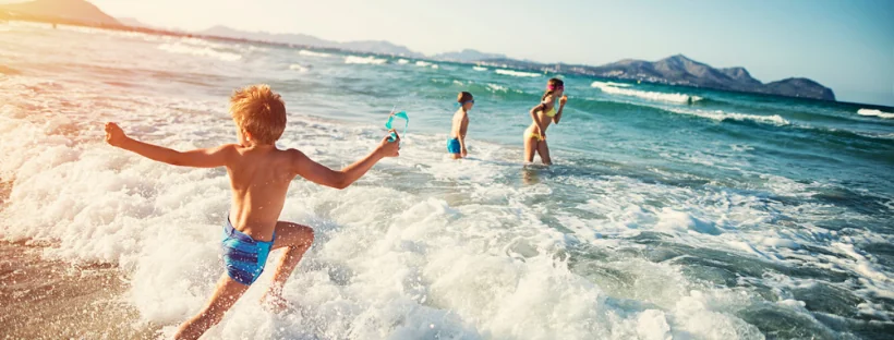 Kids Playing at the Beach On Vacation - The Early Air Way